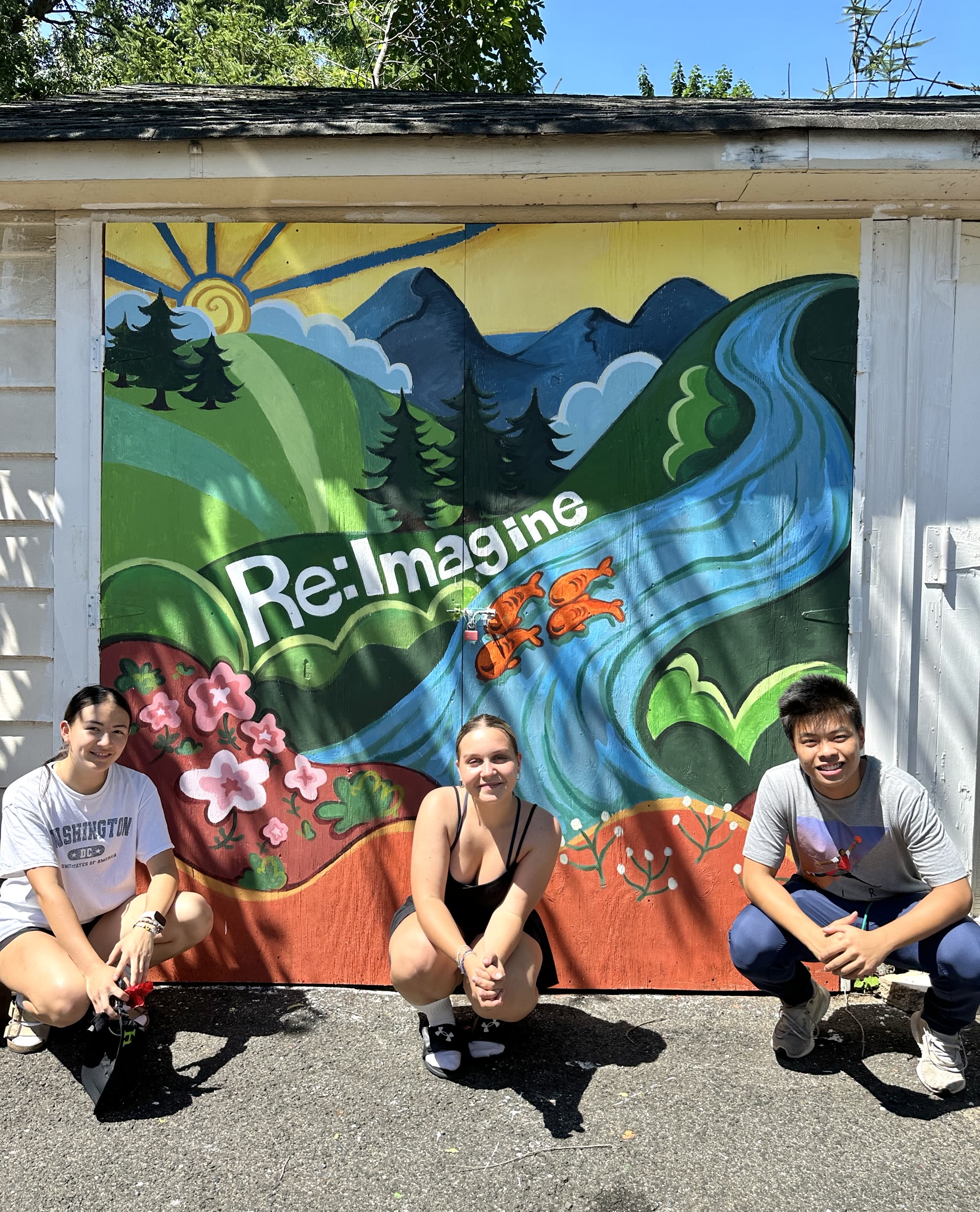 Local Hue artists with the completed Re:Imagine mural