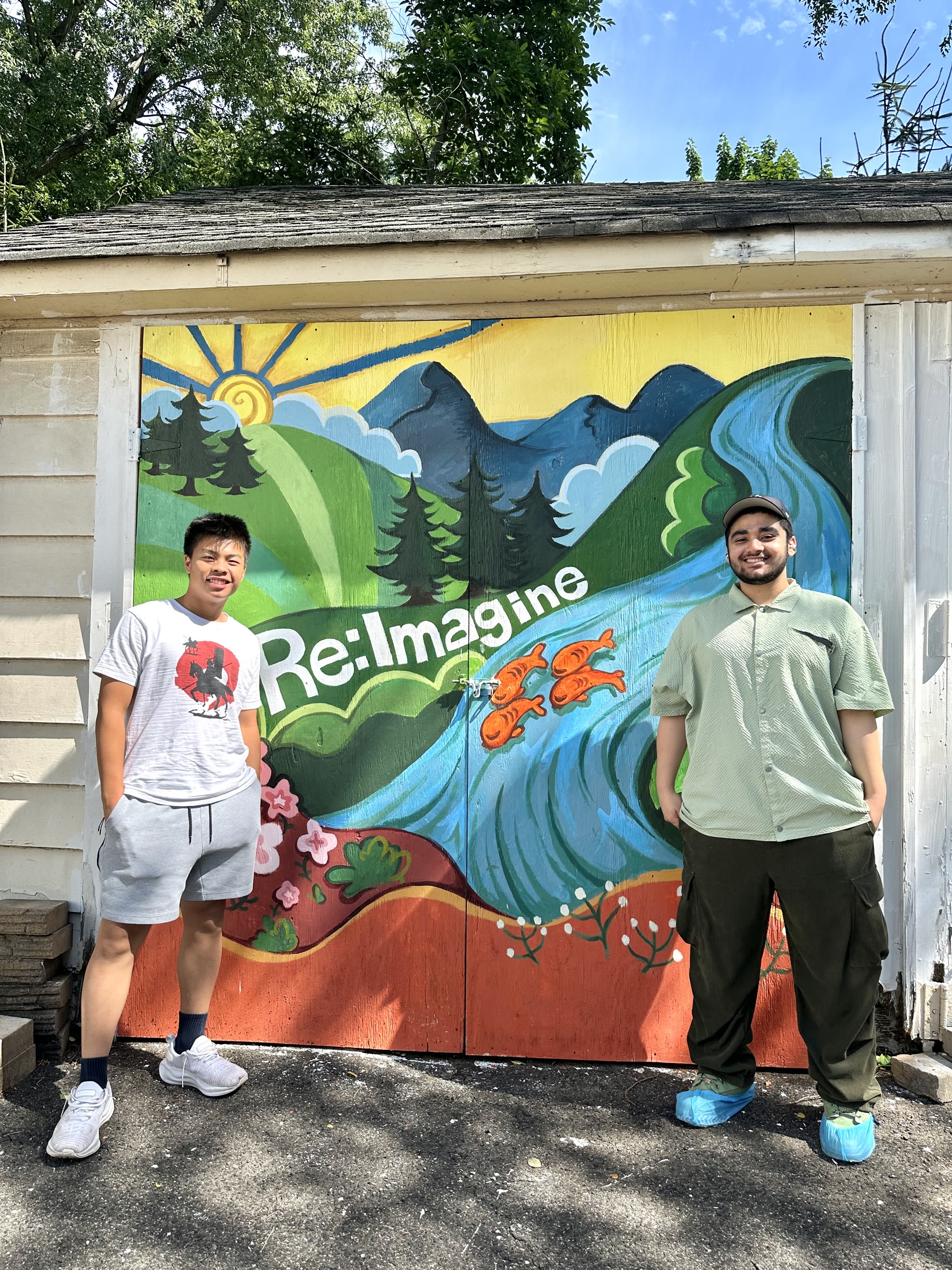 Re:Imagine members in front of the completed mural